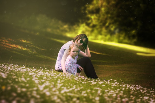 mother with kid in the fields